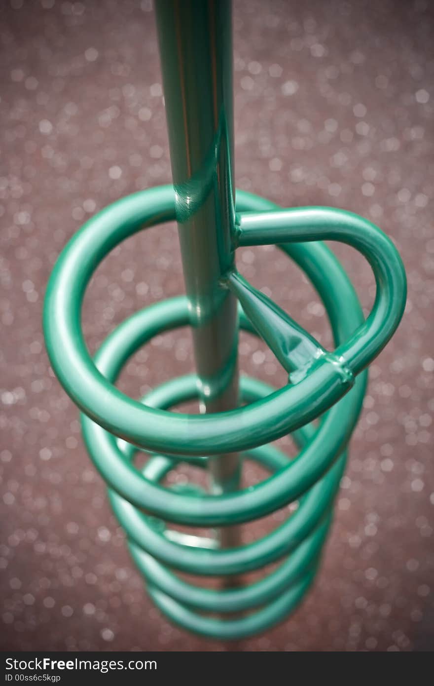 Teal green spiral climber at playground, great bokeh and depth of field