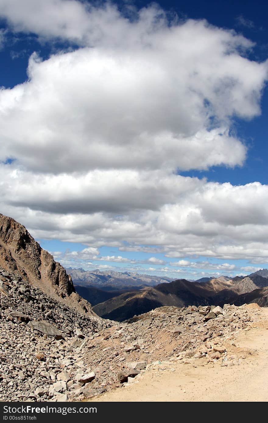 At quer mountain path, beatiful clouds and sky. At quer mountain path, beatiful clouds and sky