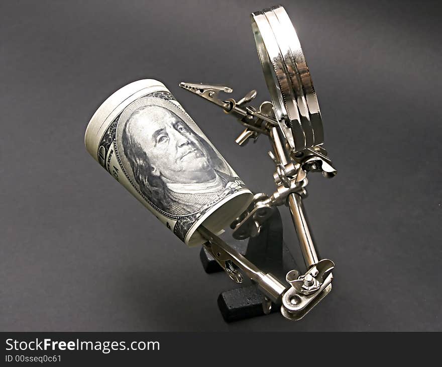 Magnifying glass man examining dollar bill. Magnifying glass man examining dollar bill