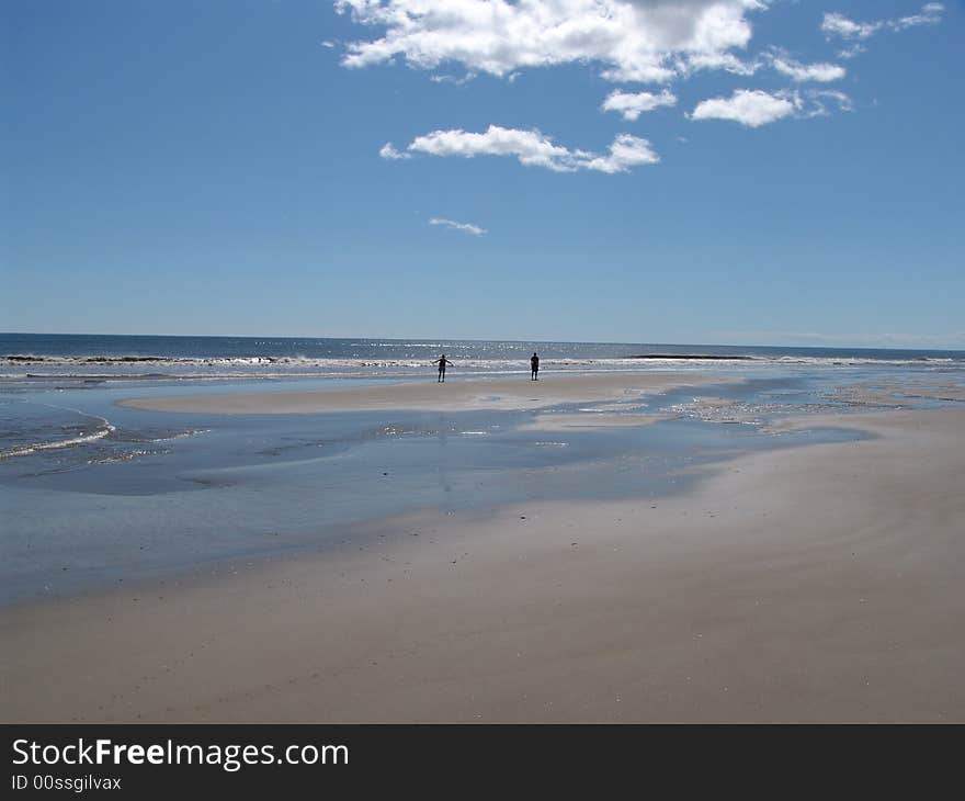 Wild beach, water, the sea, the dark blue sky, blue water