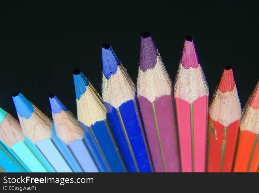 A bunch of color pencil with black background. A bunch of color pencil with black background.