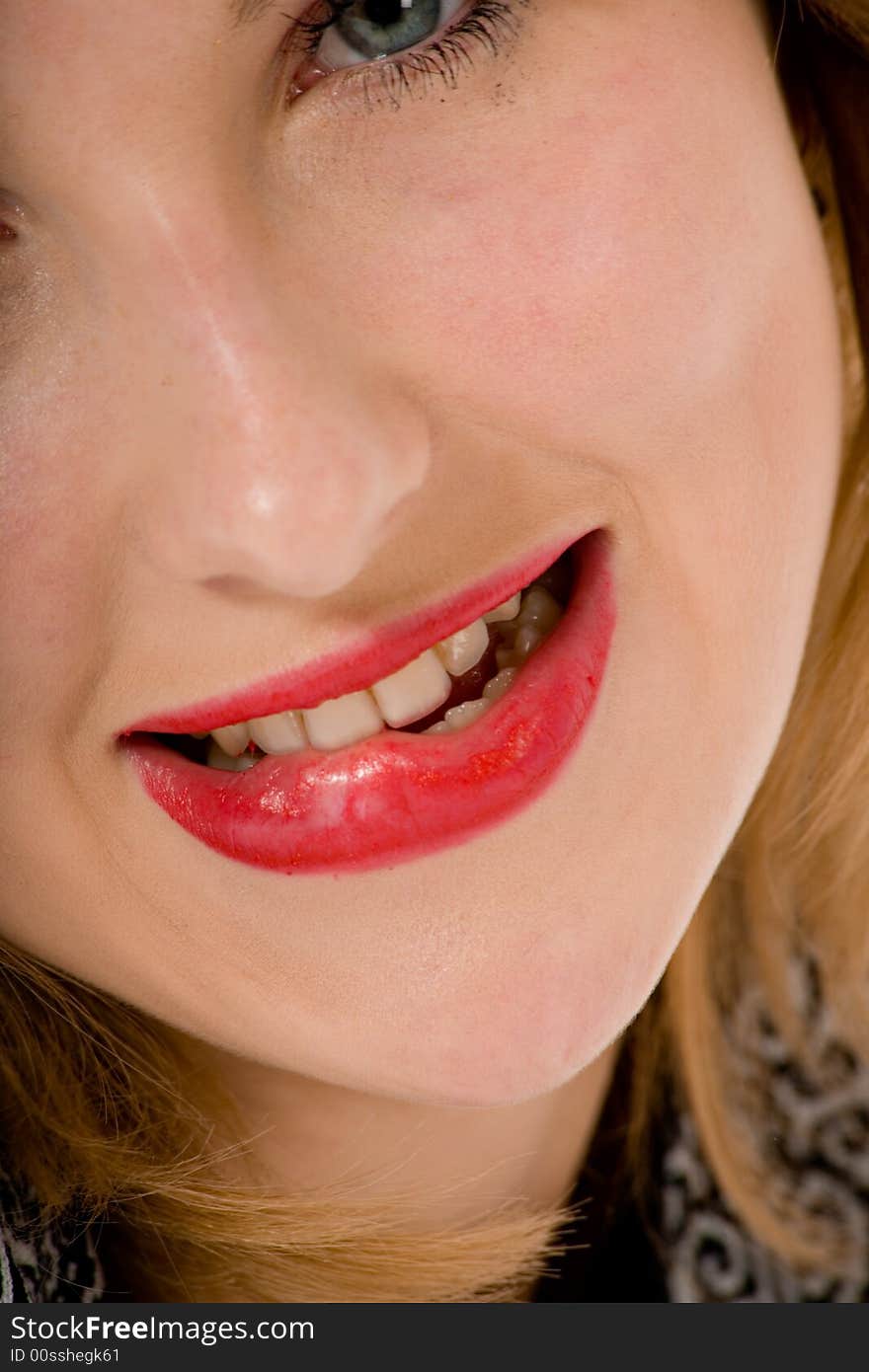 Smile of a beautiful young woman on white background