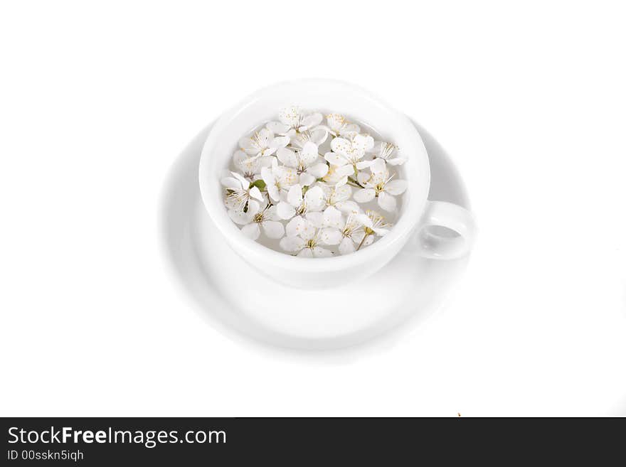 Apple flower on coffee cop on white background. Apple flower on coffee cop on white background