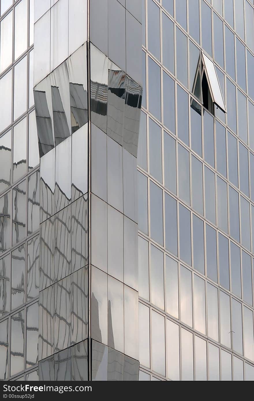 Modern skyscraper window reflections, vertical view