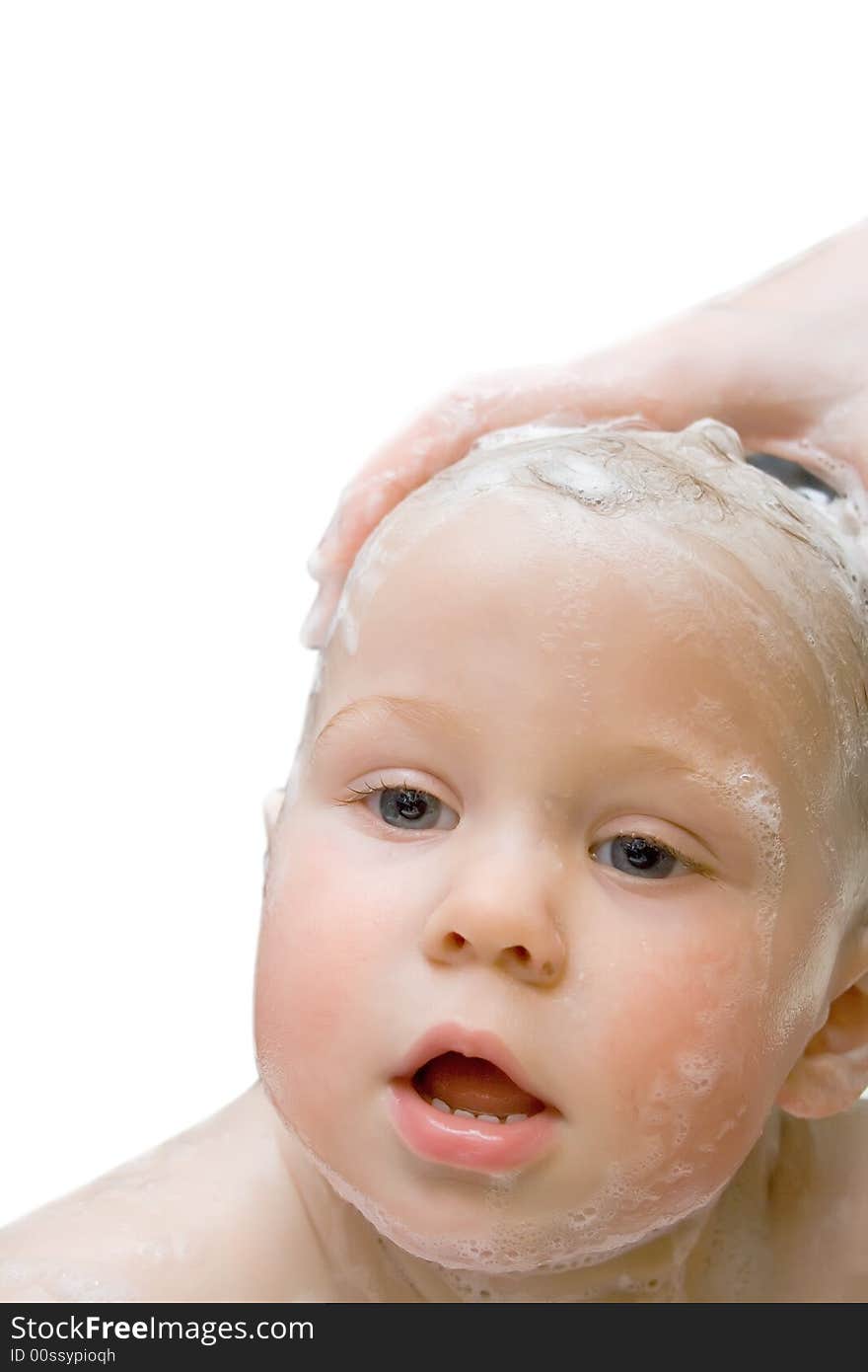 Bathing baby on isolated background looking at camera