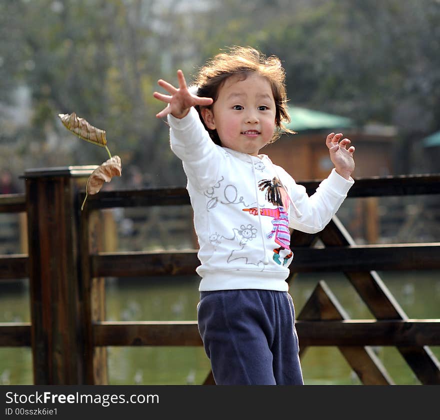 A little lovely girl is jumping.