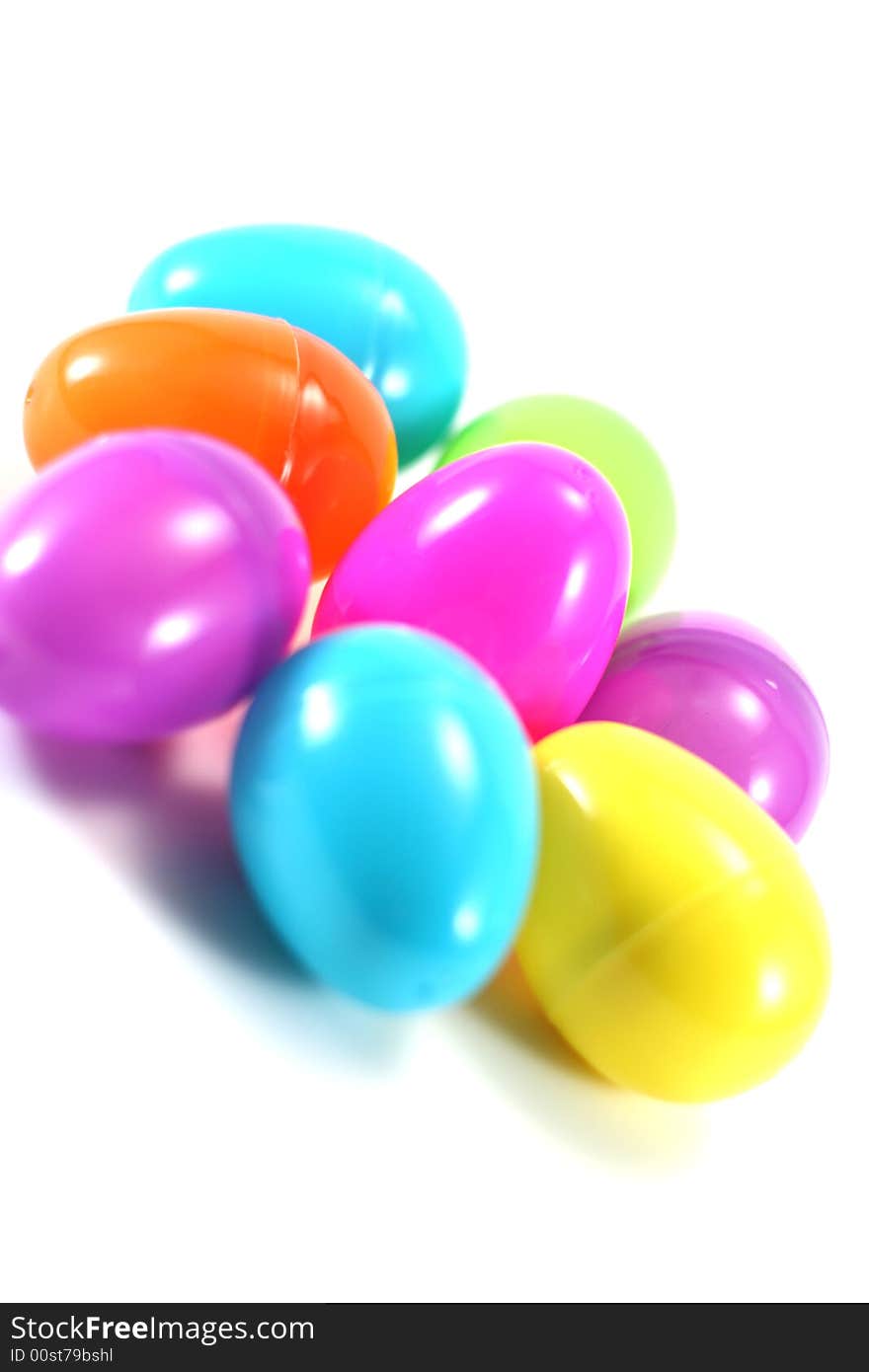 A crowd of pastel Easter eggs on white background