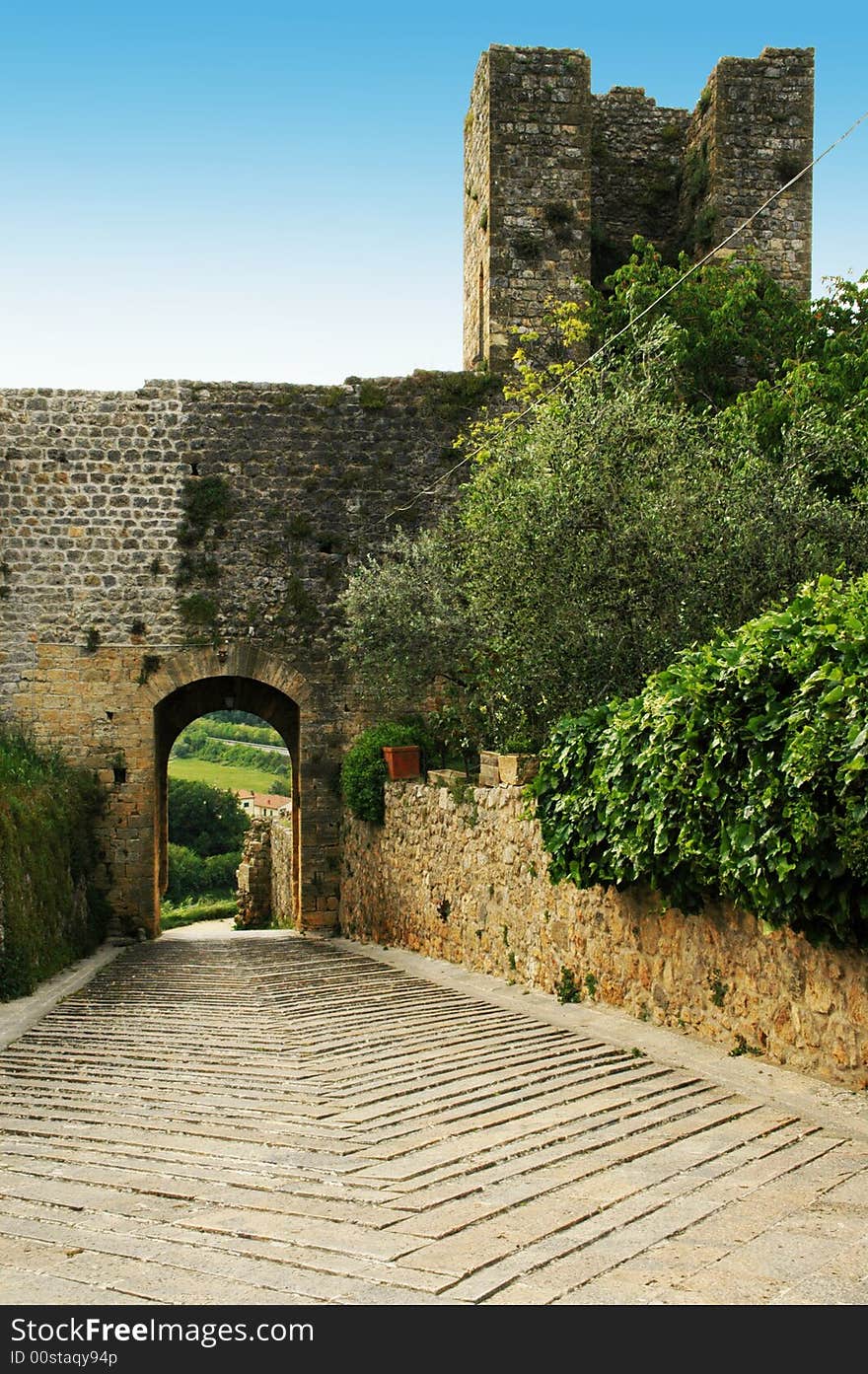 Town-walls of Monteriggioni, medieval village completely encircled from circular walls with 14 towers. Siena, Tuscany, Italy. Town-walls of Monteriggioni, medieval village completely encircled from circular walls with 14 towers. Siena, Tuscany, Italy