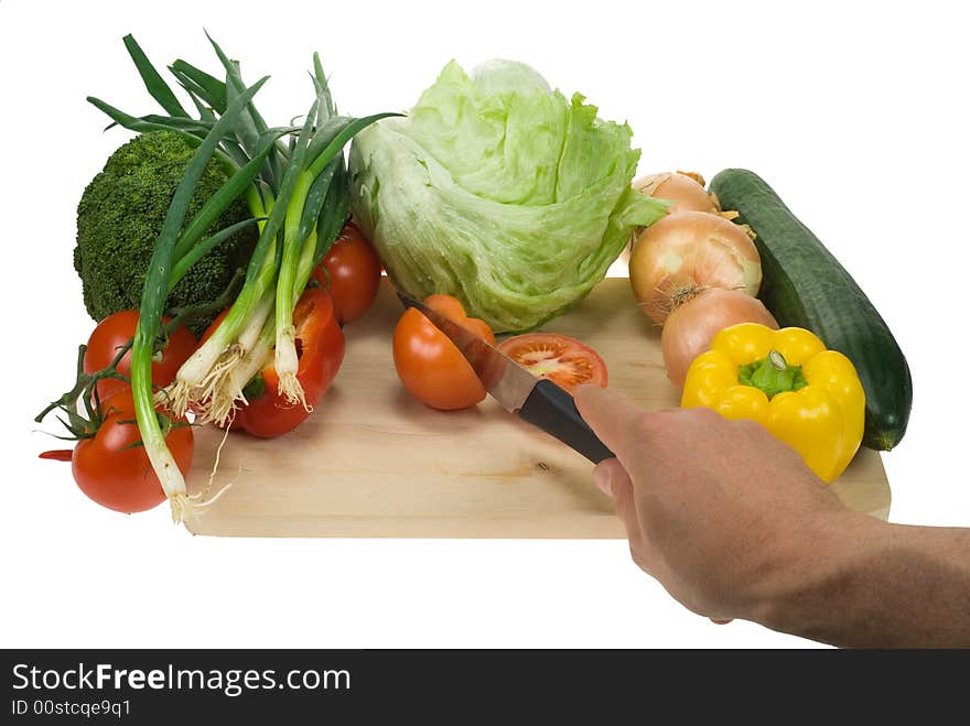 Kooking image of a cutting board, knife and vegetables. Kooking image of a cutting board, knife and vegetables