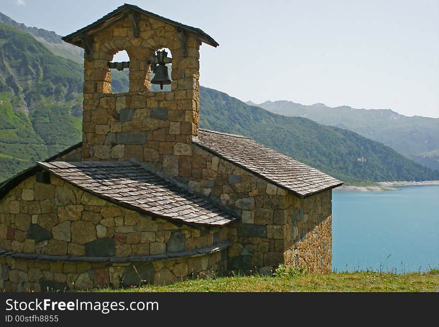 Old church at the edge of a lake in mountain. Old church at the edge of a lake in mountain