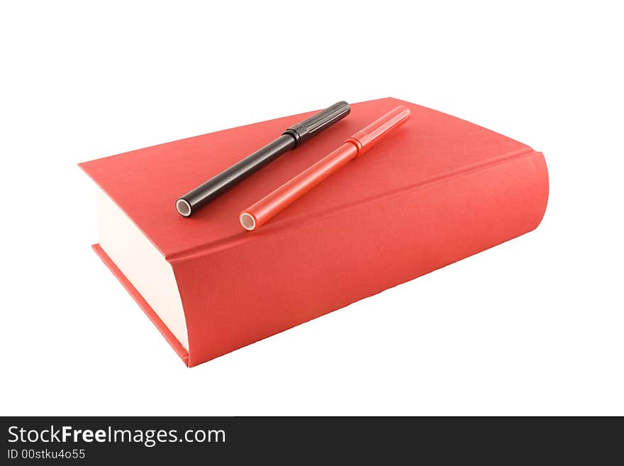 Red book and markers isolated on a white background