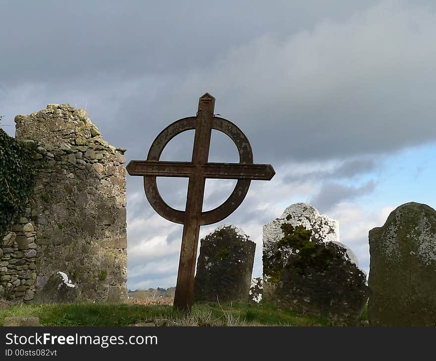 An old cemetery in Ireland with a celtic cross