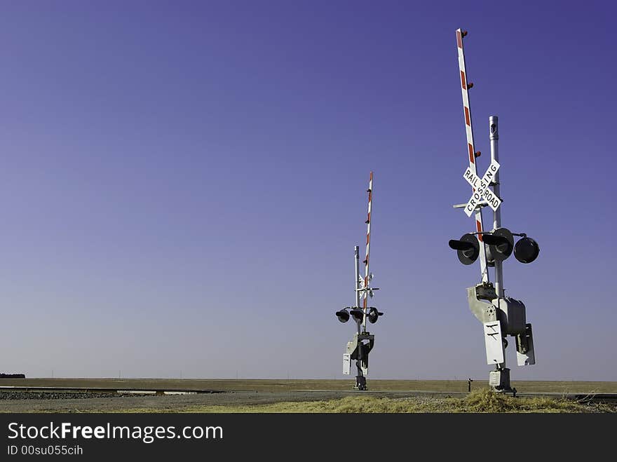 Railroad Crossing With Two Guards Standing Ready