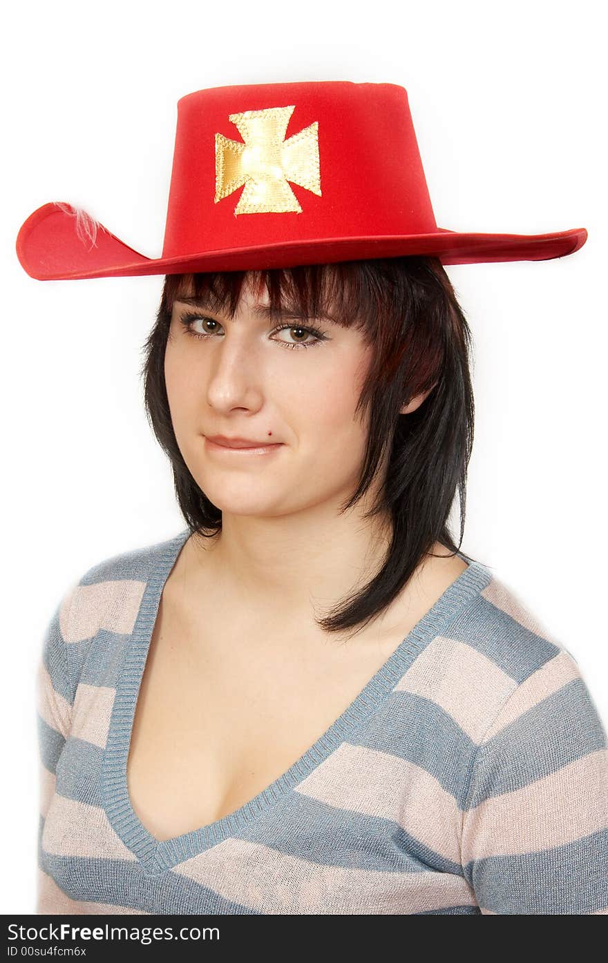 Portrait of the young woman in a red hat