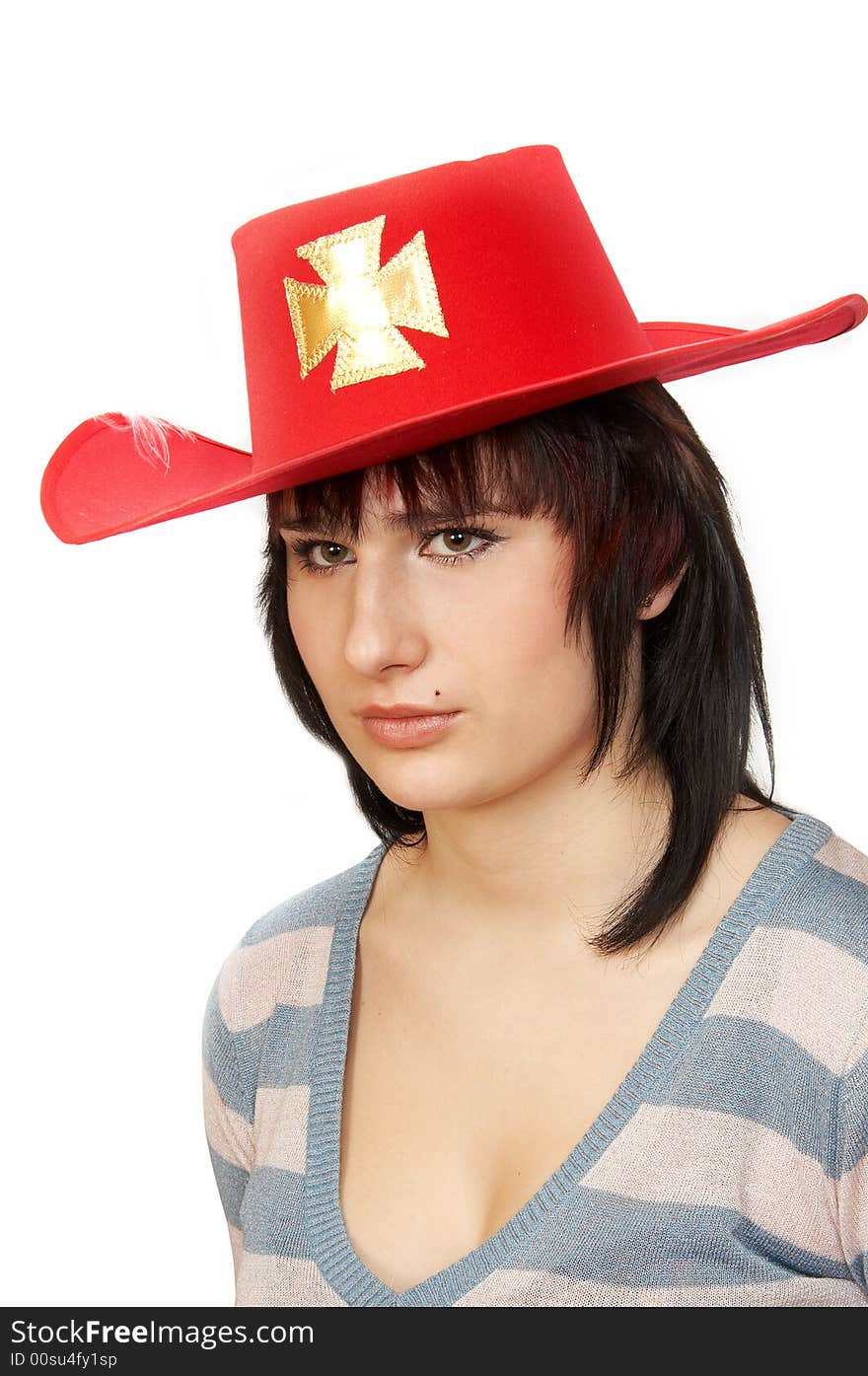 Portrait of the young woman in a red hat