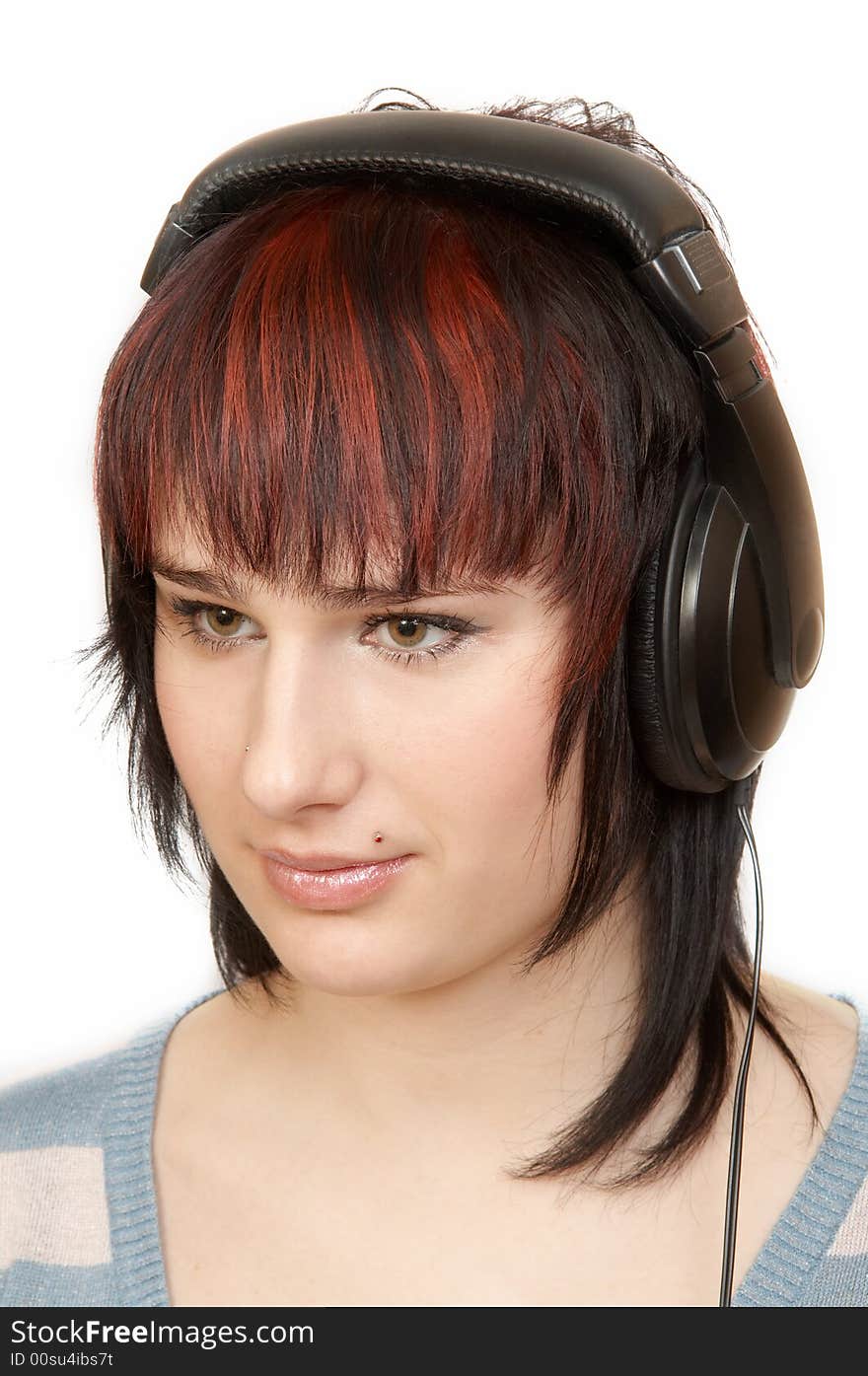 The young woman in ear-phones. The young woman in ear-phones