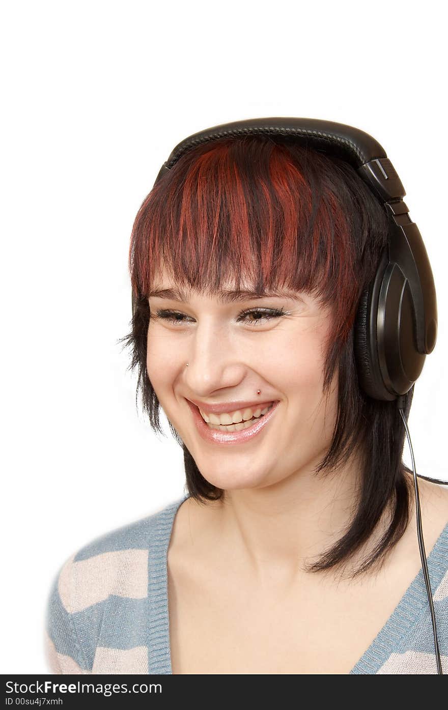 The young woman in ear-phones. The young woman in ear-phones