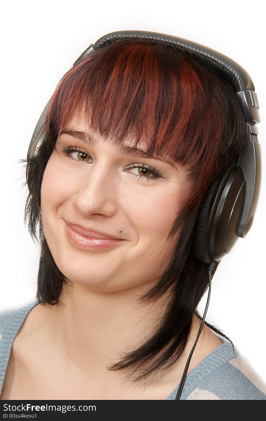 The young woman in ear-phones. The young woman in ear-phones