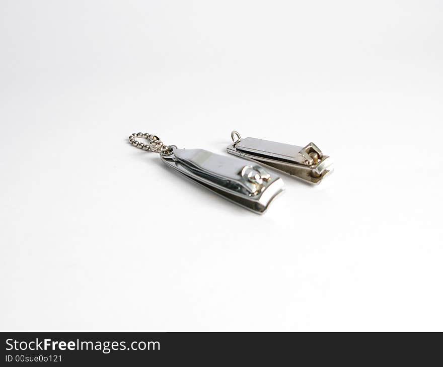 Two silver nail cutters on white background. Two silver nail cutters on white background
