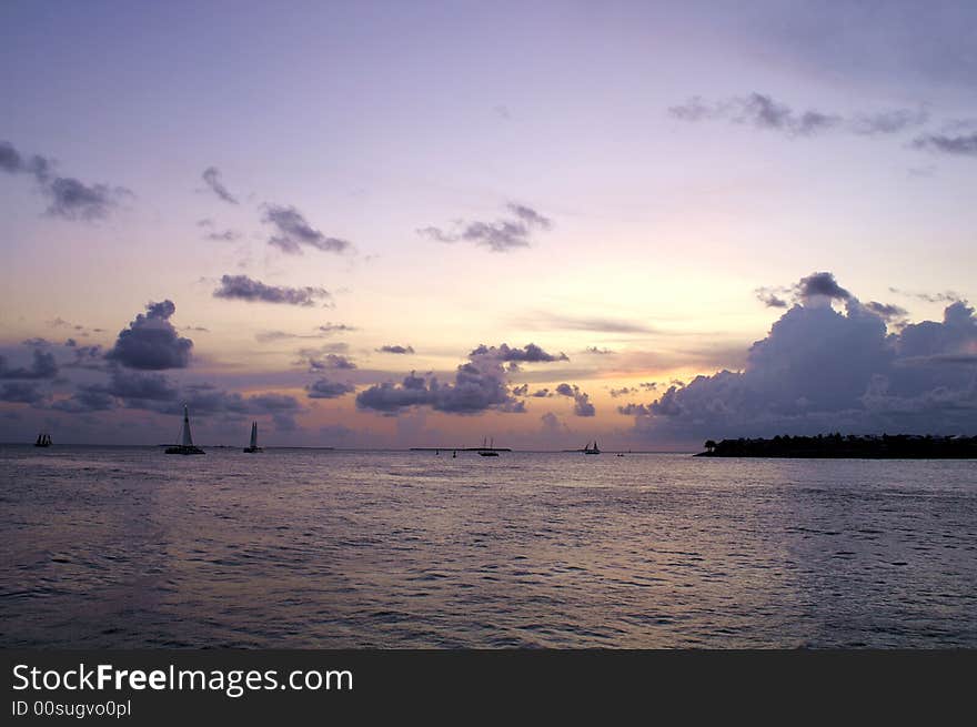 Peaceful dust by the sea with sailboats