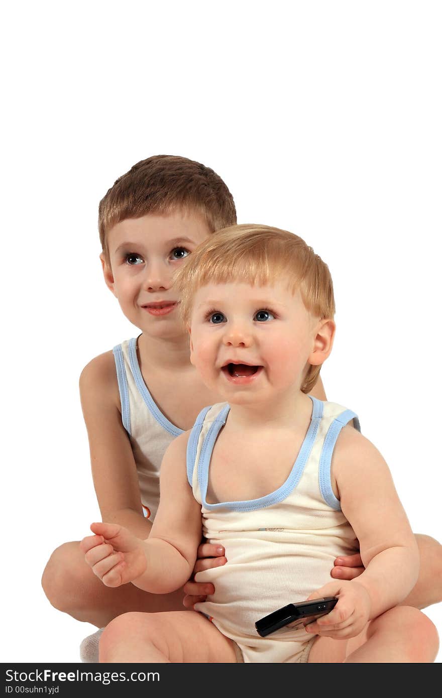 Two boys in identical clothes look in the chamber