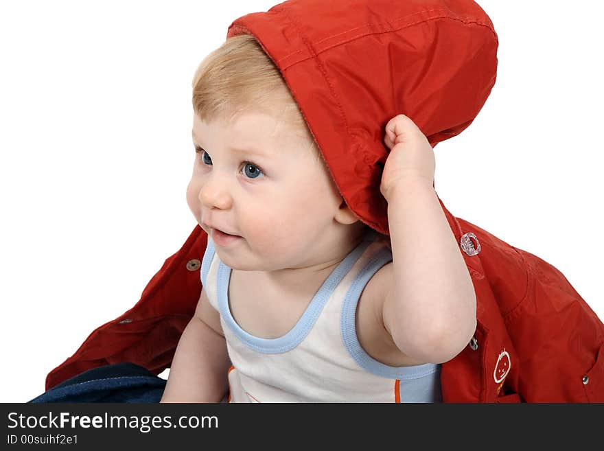 The beautiful little boy tries on clothes. The beautiful little boy tries on clothes