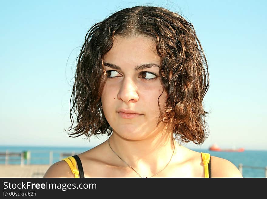 Beautiful young girl at the sea. Beautiful young girl at the sea.