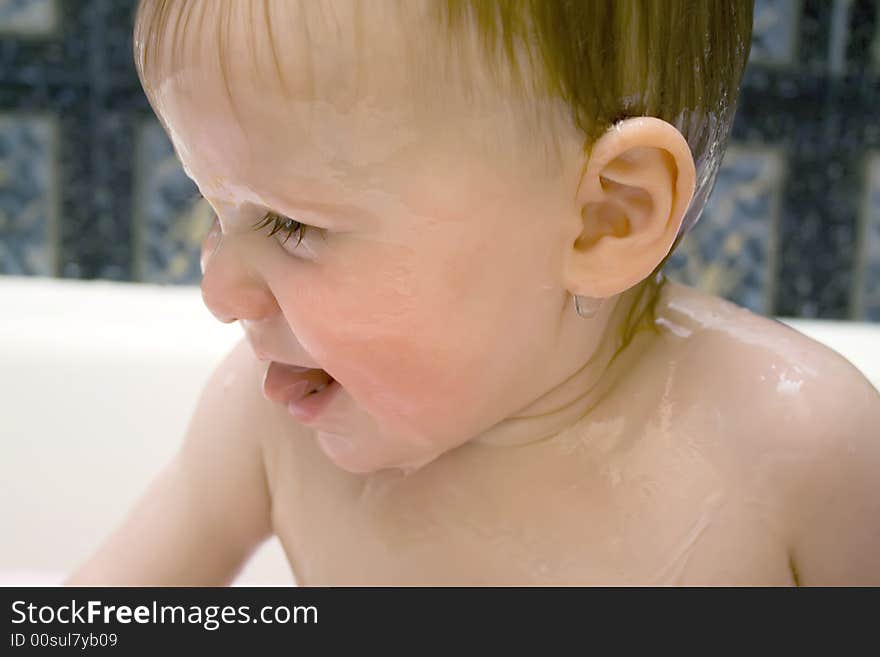 Bathing and smiling baby under the douche. Bathing and smiling baby under the douche