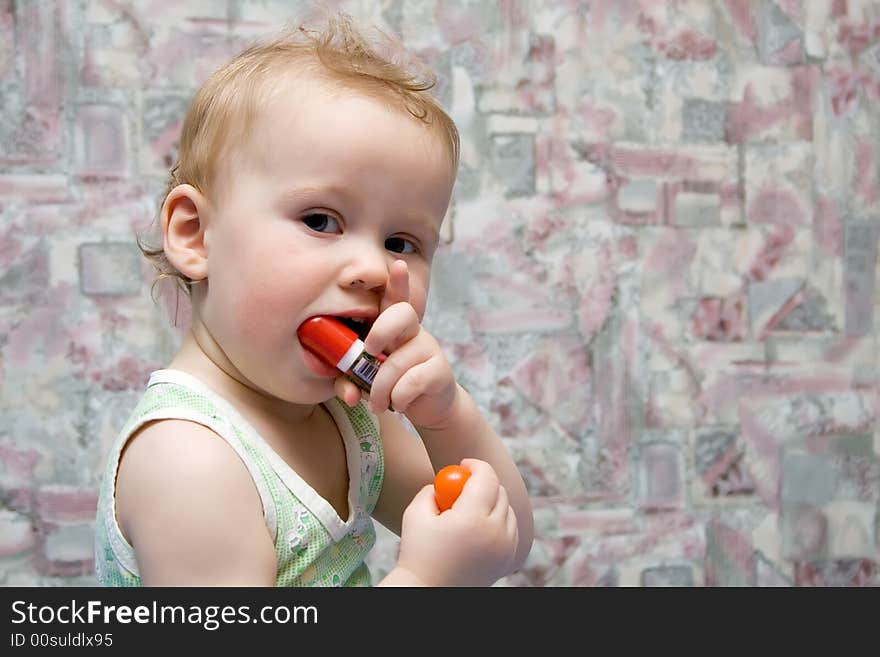 Smiling baby with marker in hands