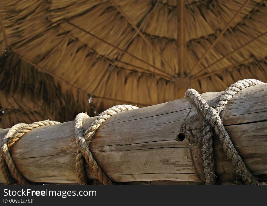 Bamboo fence and awning on a sea beach