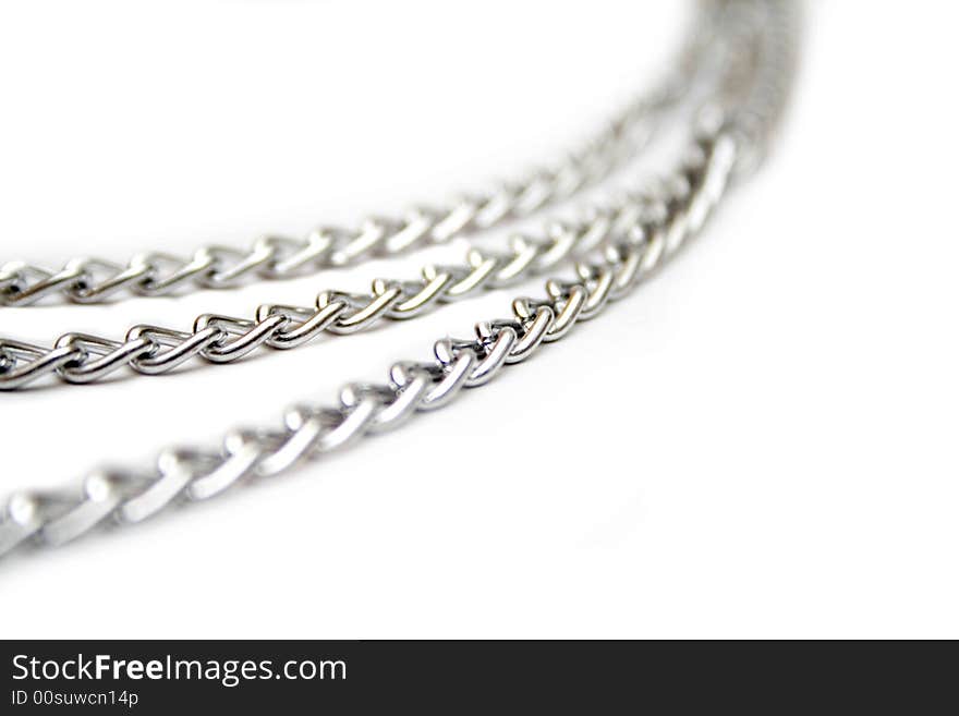 Fragment of silver chain on the white isolated background