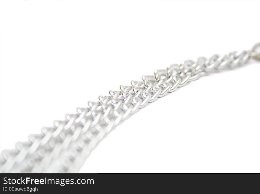 Fragment of silver chain on the white isolated background