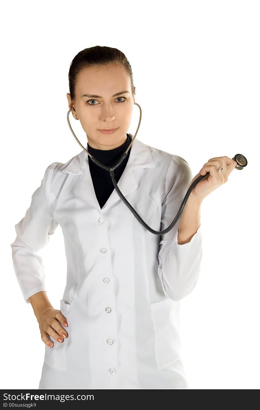 A young female doctor in a white cloak with a stethoscope.