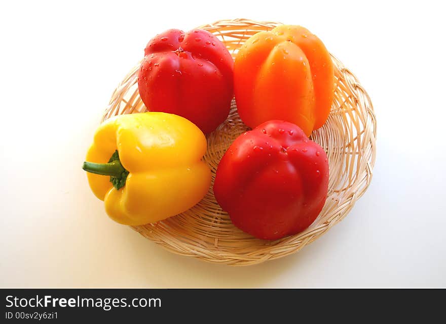 Multi-coloured pepper in basket. Multi-coloured pepper in basket.