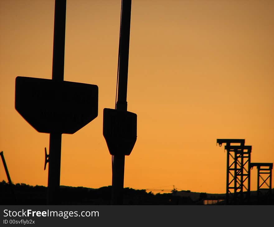 Two pillars at the harbor photographed in the sunset. Two pillars at the harbor photographed in the sunset