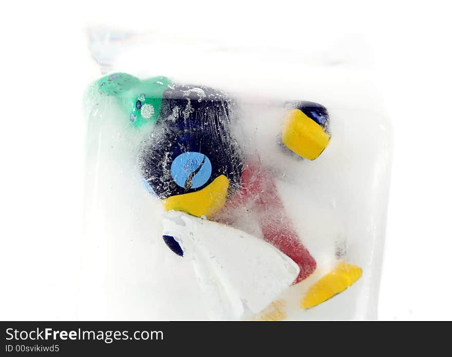 Frozen penguin with a cold in a block of ice