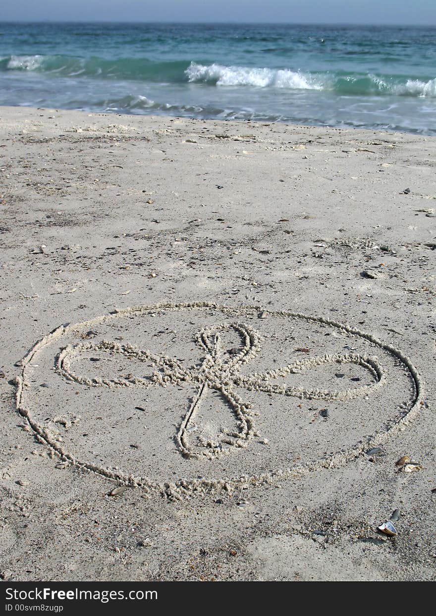 Flower drawing on the white sand. Flower drawing on the white sand