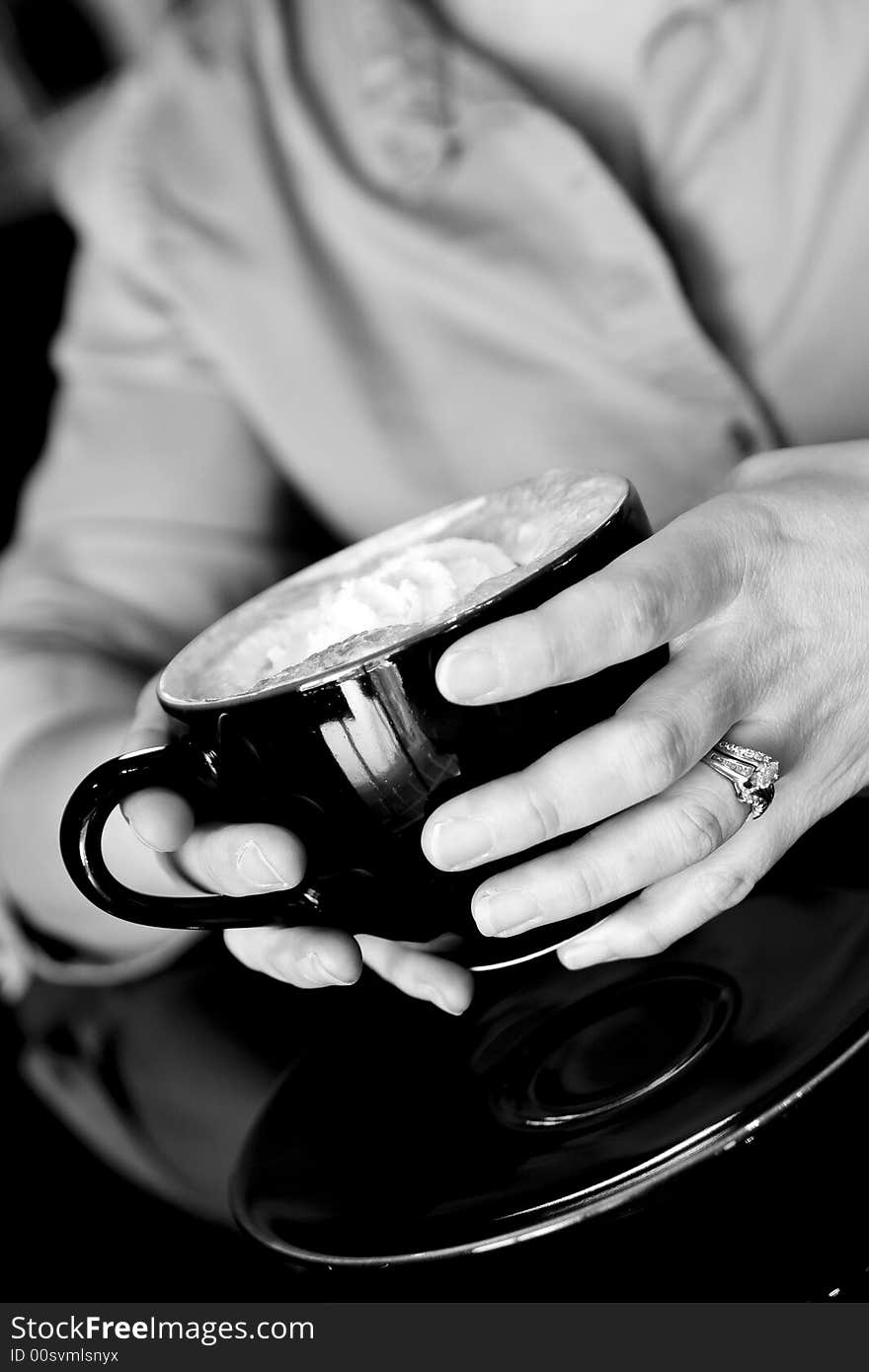 Hands holding coffee