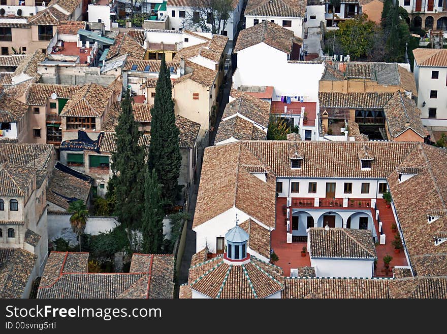 This European residential neighborhood in Granada, Spain is centrally divided and tightly squeezed by a narrow alleyway. This European residential neighborhood in Granada, Spain is centrally divided and tightly squeezed by a narrow alleyway.