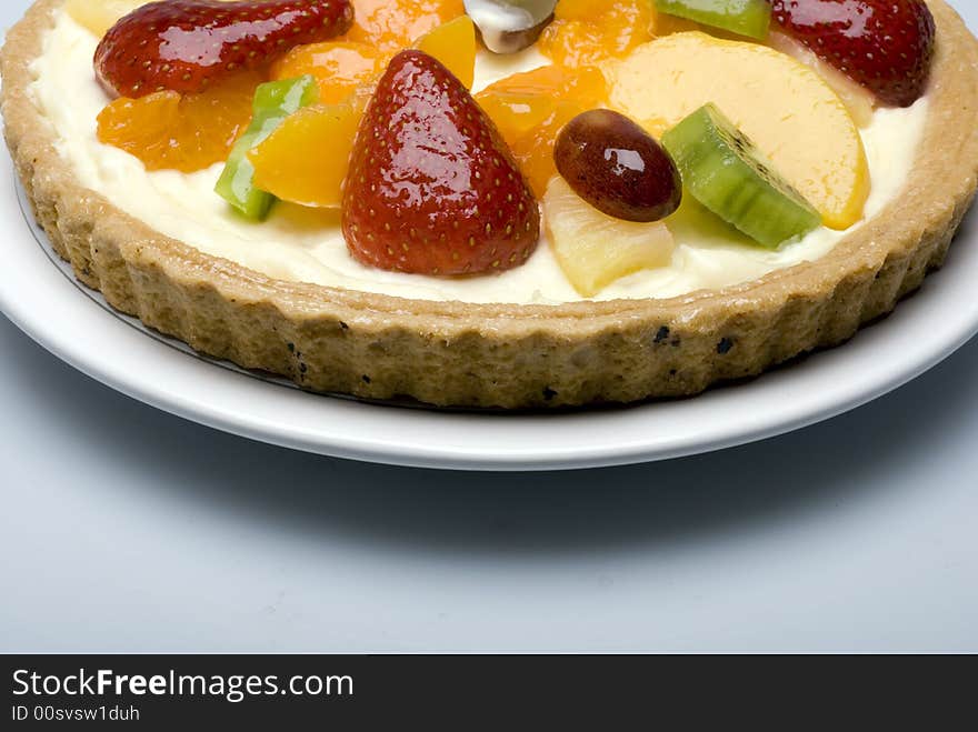 A fruit pie on a white plate