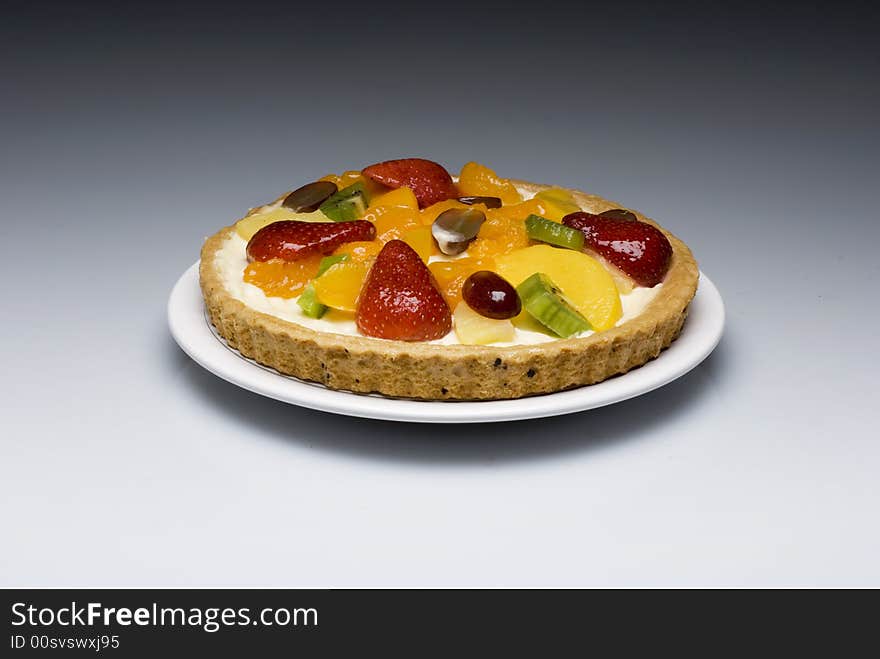 A fruit pie on a white plate