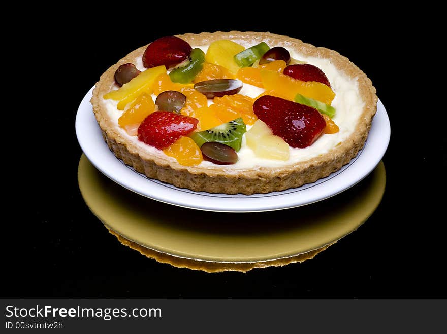 A fruit pie on a white plate