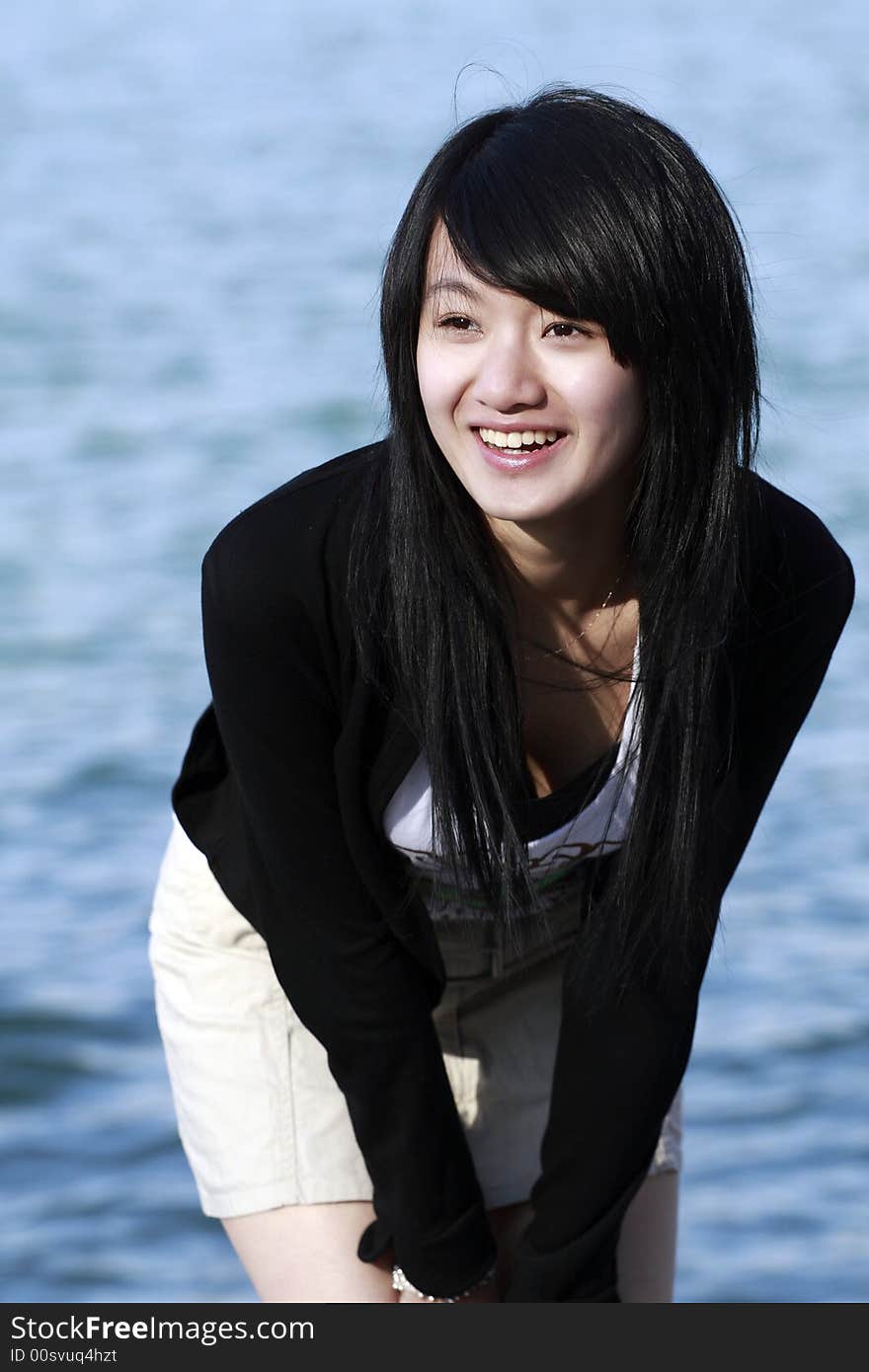 A Chinese girl with the charming smile. A Chinese girl with the charming smile.