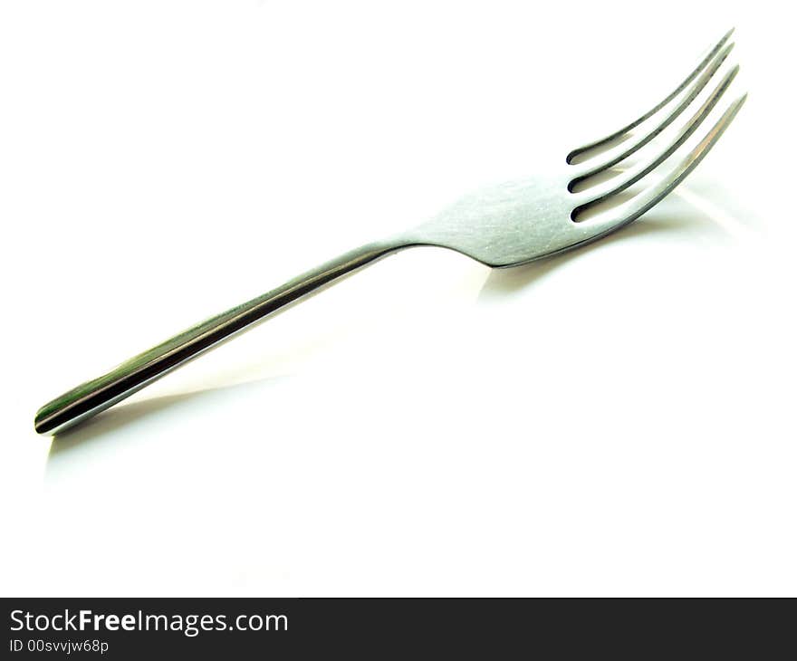 Fork on white background, high-key. Fork on white background, high-key