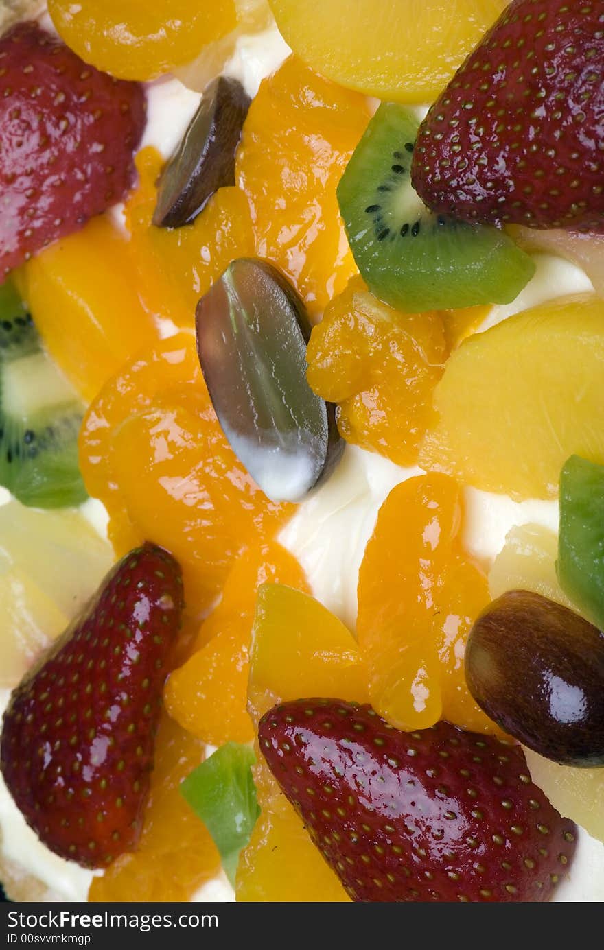 A fruit pie on a white plate on a black background