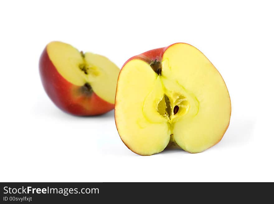 The isolated cut red apples. The isolated cut red apples