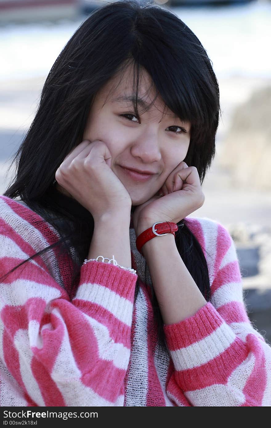 A Chinese girl with the charming smile. A Chinese girl with the charming smile.