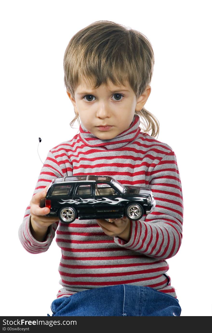 Little boy plays with his black toy car. Little boy plays with his black toy car