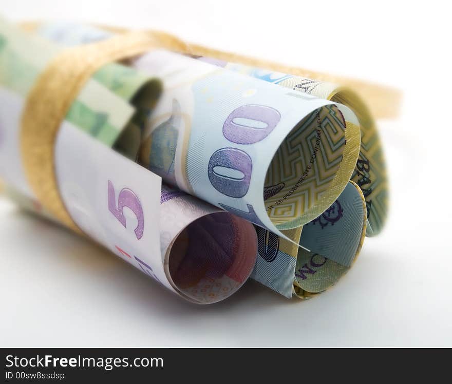 Gift-wrapped banknotes on a white background. Gift-wrapped banknotes on a white background