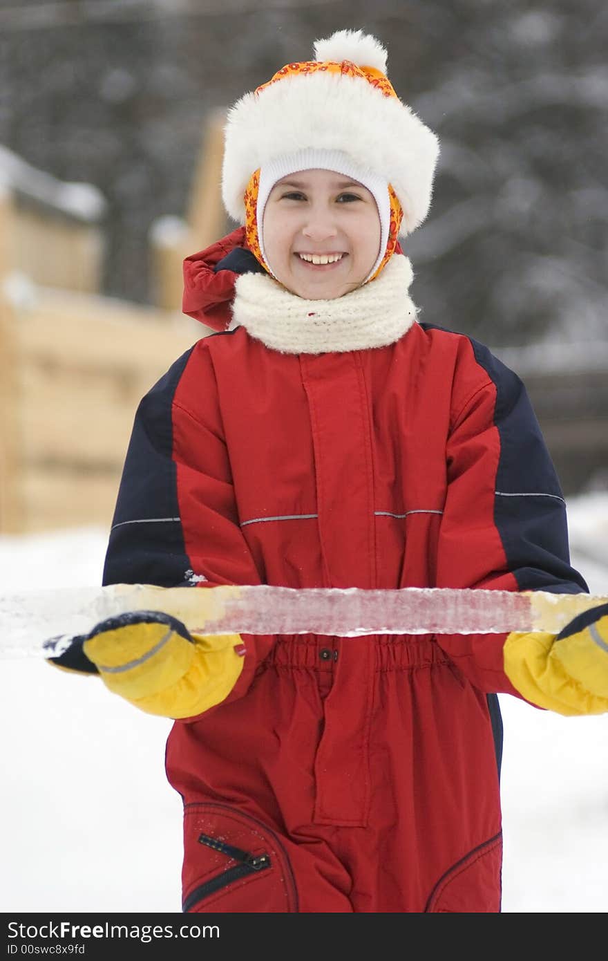 Happy girl with ice in snow suit